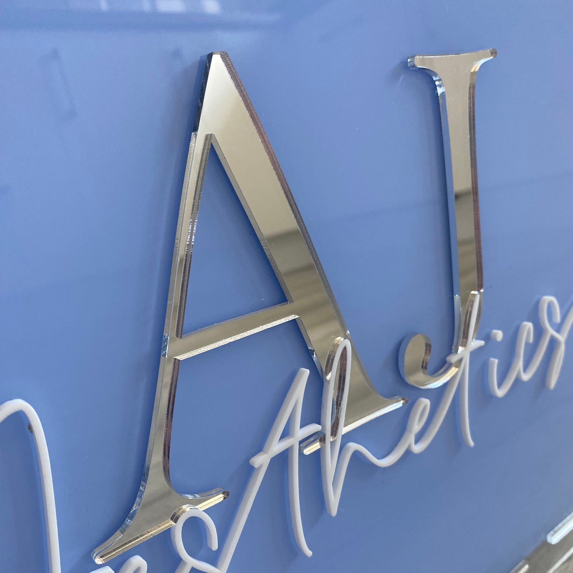 Close up photo showing the 3d detail of the acrylic business logo sign