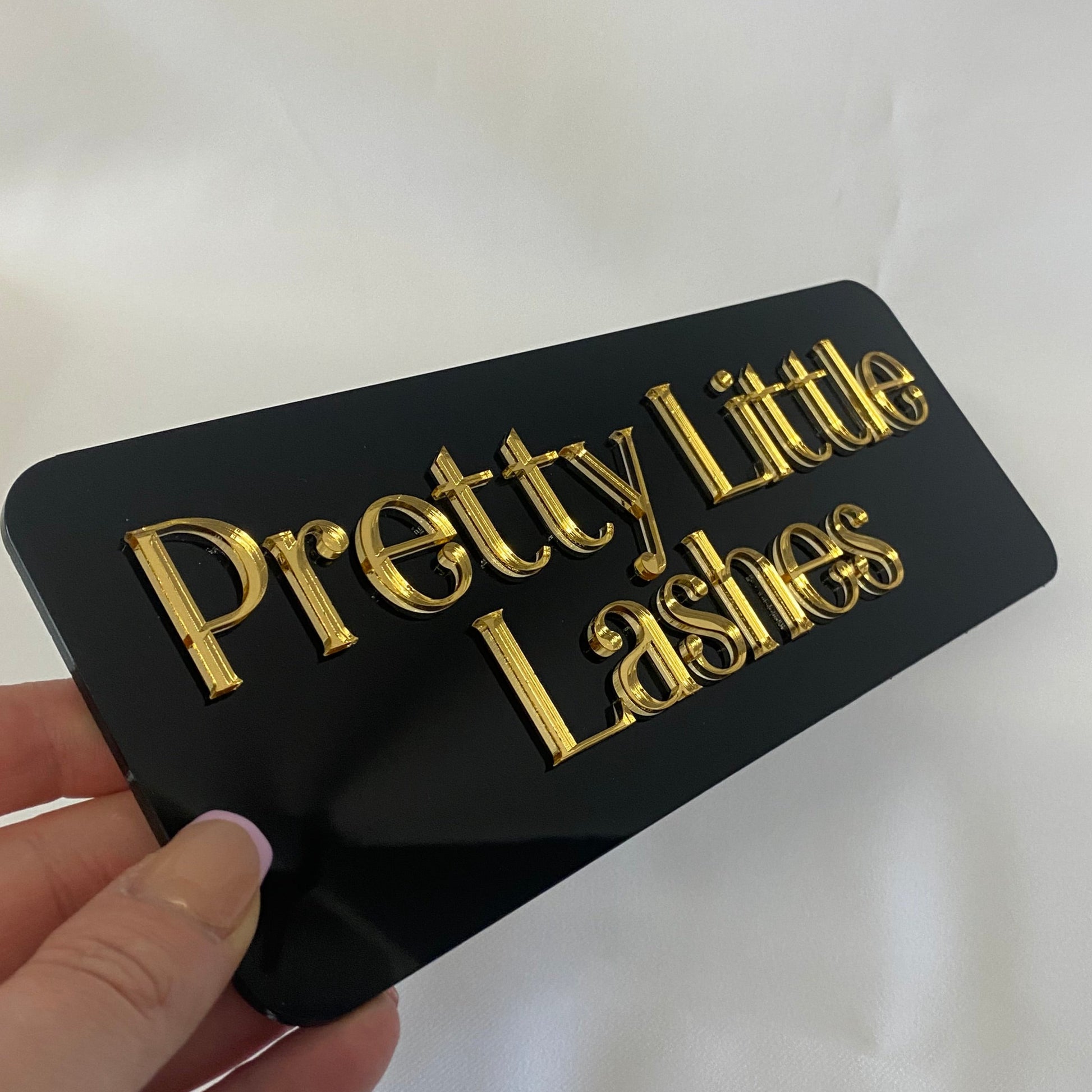 Acrylic Business sign with business name in gold mirror acrylic on black gloss acrylic