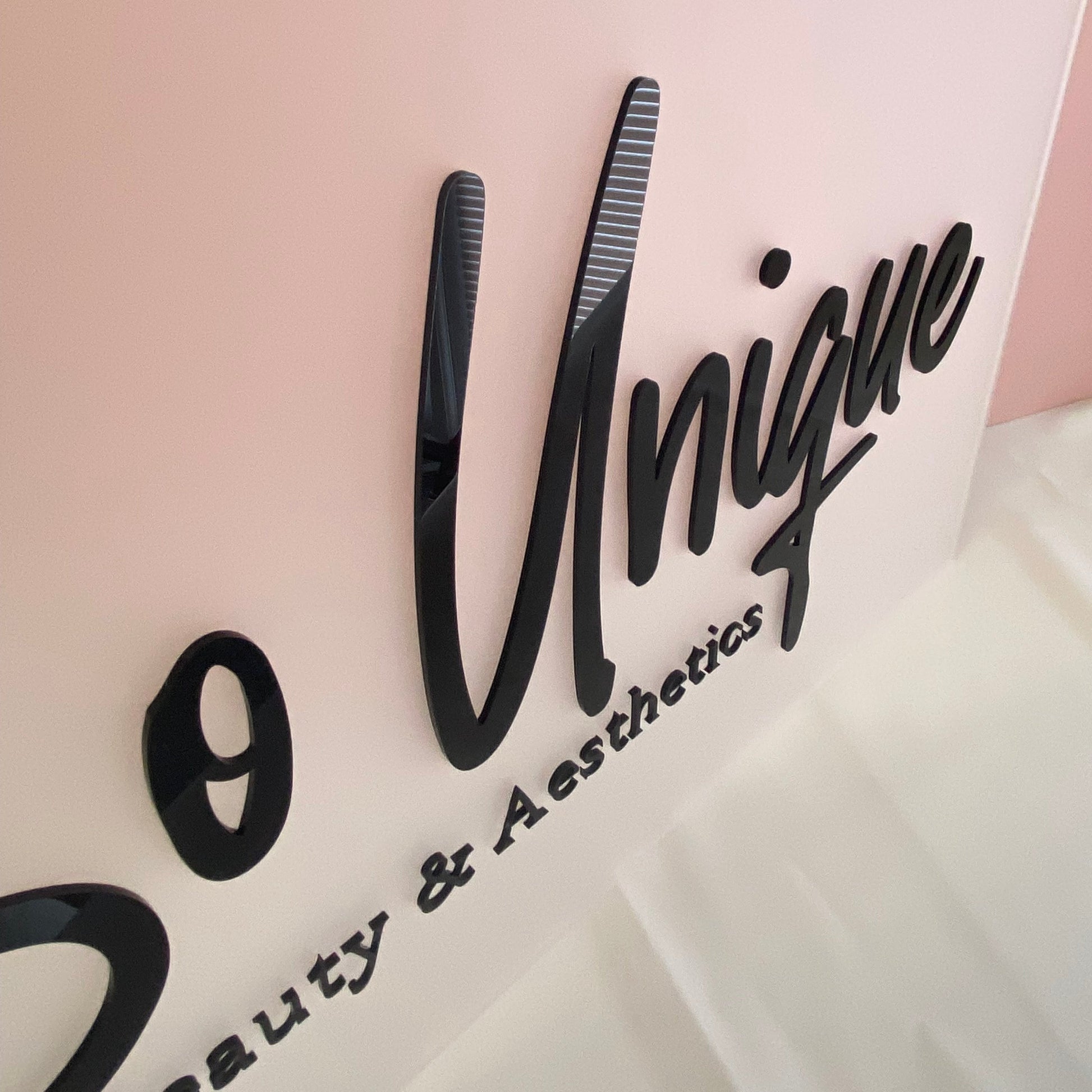 Close up to show the detail of Acrylic Salon Sign - Frosted acrylic background with black gloss 3d business logo