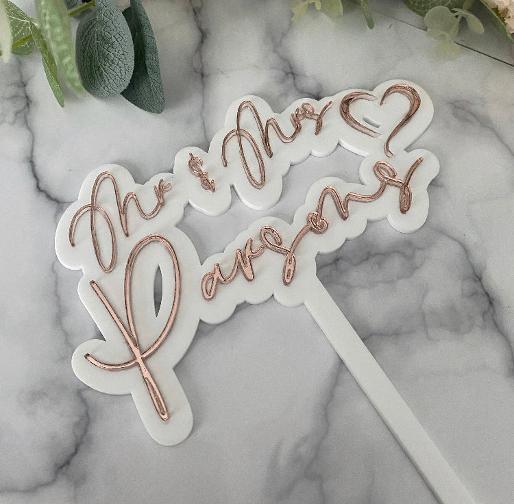 Double layer Wedding Cake topper with Mr and Mrs 'surname' shown next to a bridal bouquet.