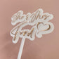 Decorative wedding cake topper with rose gold text on a frosted white acrylic background